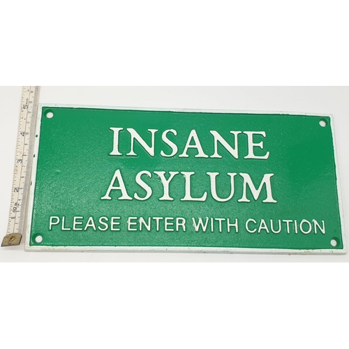 84 - A cast iron sign reading INSANE ASYLUM. Dimensions: 27 x 13 cm.