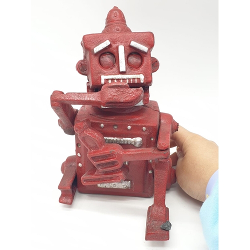 98 - A cast iron, mechanical, money box in the shape of a robot. With moving hands, jaw and eyes. In exce... 