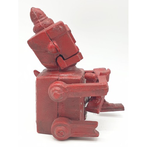 98 - A cast iron, mechanical, money box in the shape of a robot. With moving hands, jaw and eyes. In exce... 