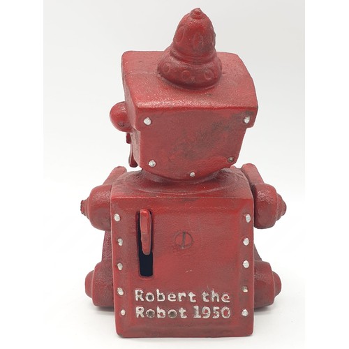 98 - A cast iron, mechanical, money box in the shape of a robot. With moving hands, jaw and eyes. In exce... 