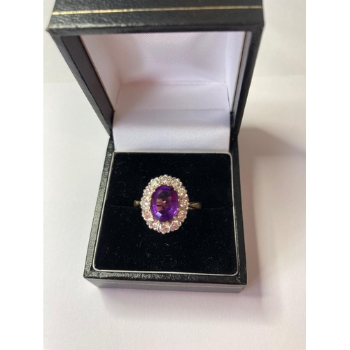 50 - 18Ct Gold, Diamond and Amethyst RING.  Having a large 2 carat faceted oval Amethyst to top with a 1.... 