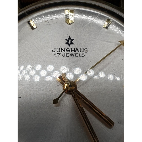 152 - A vintage 14ct gold Junghans men's watch. Gold case with silver dial. Comes with original leather st... 