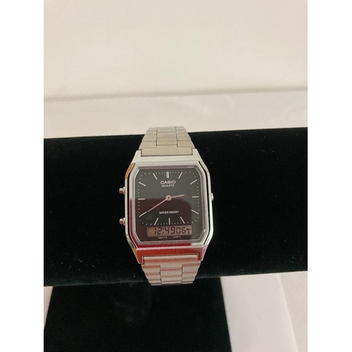 141 - Vintage Casio AQ 230 WRISTWATCH.  Black face Model with alarm feature.  Casio metal strap. Full Work... 