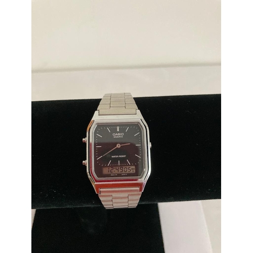 141 - Vintage Casio AQ 230 WRISTWATCH.  Black face Model with alarm feature.  Casio metal strap. Full Work... 