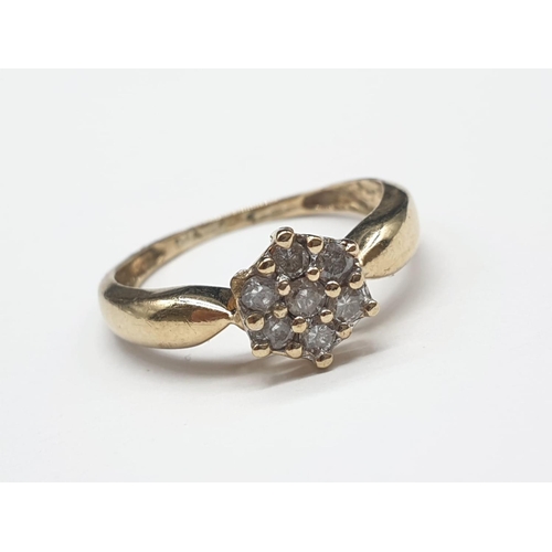 104 - 9ct yellow gold diamond cluster ring size M. 1.7g and 0.25ct.