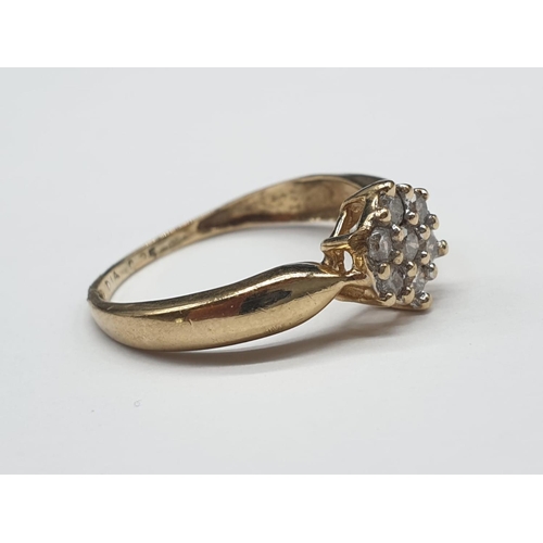 104 - 9ct yellow gold diamond cluster ring size M. 1.7g and 0.25ct.