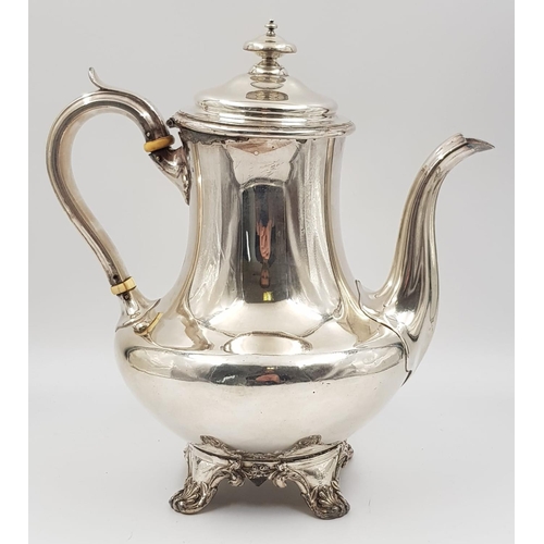 29 - An Antique Silver Coffee Pot, sitting on ornate decorated claw-feet. Classic design with slight wear... 