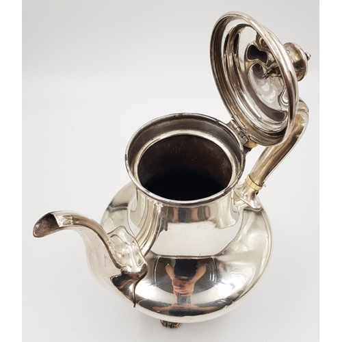 29 - An Antique Silver Coffee Pot, sitting on ornate decorated claw-feet. Classic design with slight wear... 