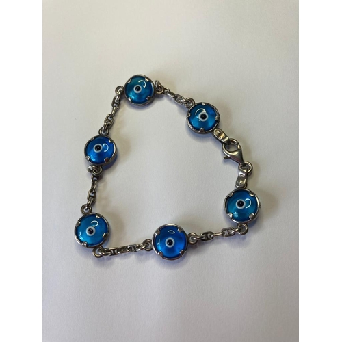 564 - Silver Nazar bracelet with turquoise blue stones in 'eye' fashion and said to keep evil away. 925 si... 