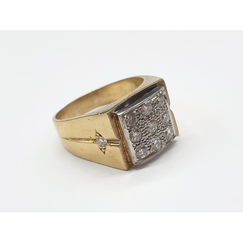 107 - A Gents 18ct Gold and Diamond (2.5 carats) Fashion Ring. 9 Diamonds on face, 2 on shoulders. Size X.... 