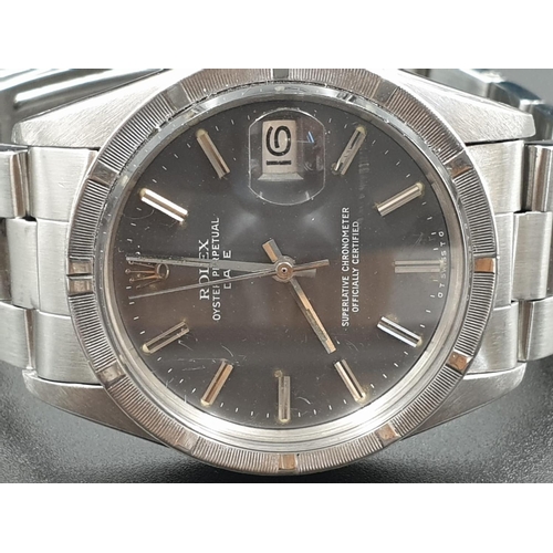 14 - Rolex Stainless Steel Oyster Perpetual WATCH with date box and Silver face.  32mm