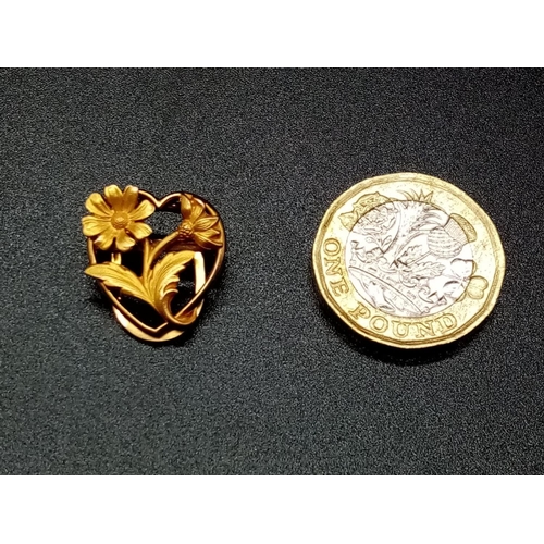 570 - Yellow Metal French CLIP in floral design.  1.8g   1.7cm