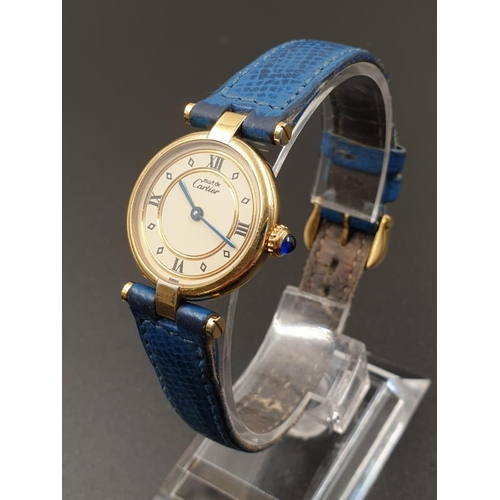 35 - Cartier Quartz Ladies WATCH. Gold plated on Silver with Roman Numerals and Blue Leather Strap.    24... 