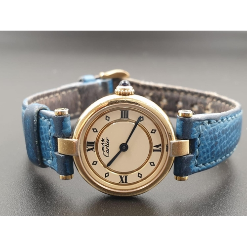 35 - Cartier Quartz Ladies WATCH. Gold plated on Silver with Roman Numerals and Blue Leather Strap.    24... 