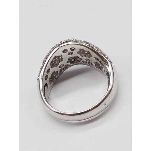 137 - 18ct White Gold RING with encrusted Diamond face.  Modern design.  13.1g     Size: U