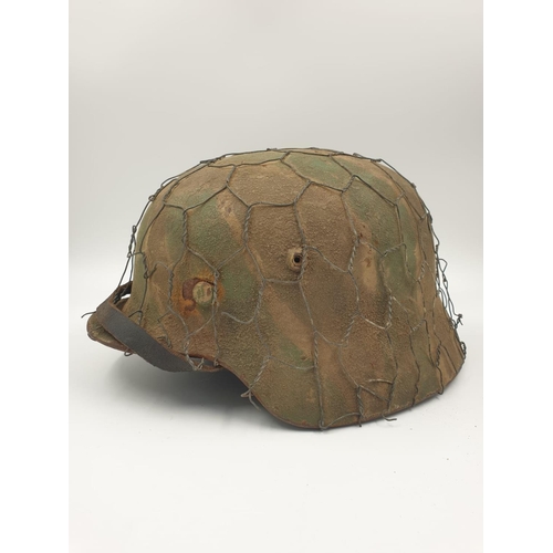 36 - 100% Original German M35 Helmet in Normandy Cam. The textured paint work appears to be of the period... 