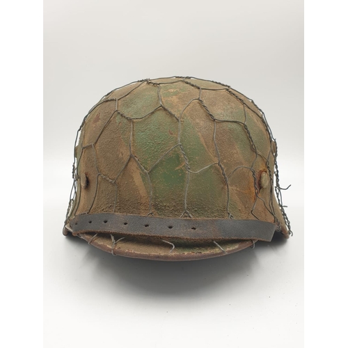 36 - 100% Original German M35 Helmet in Normandy Cam. The textured paint work appears to be of the period... 