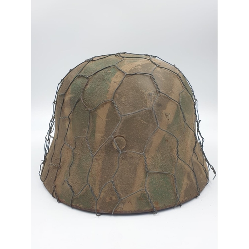 36 - 100% Original German M35 Helmet in Normandy Cam. The textured paint work appears to be of the period... 