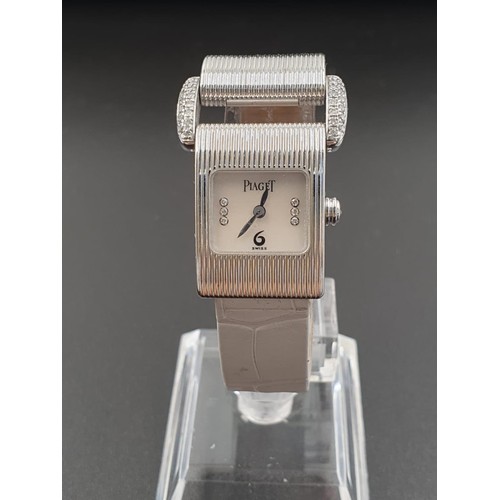 11 - Piaget 18ct White Gold Ladies WRISTWATCH with encrusted Diamonds Bezel. The face is Tank style. Inte... 