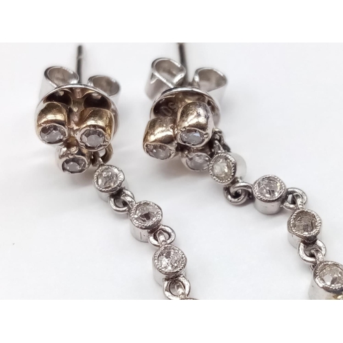 144 - Pair of 14ct White Gold Drop EARRINGS with brilliant cut Diamonds and central Sapphire.   6.6g     3... 