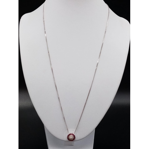 68 - Diamond and Ruby circular PENDANT on a 9ct White Gold CHAIN.   5.4g      54cm  chain