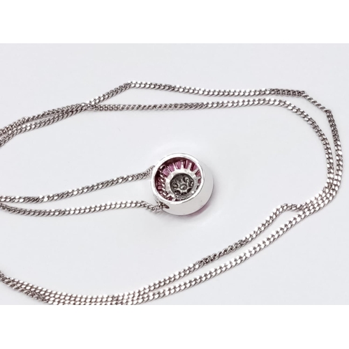 68 - Diamond and Ruby circular PENDANT on a 9ct White Gold CHAIN.   5.4g      54cm  chain