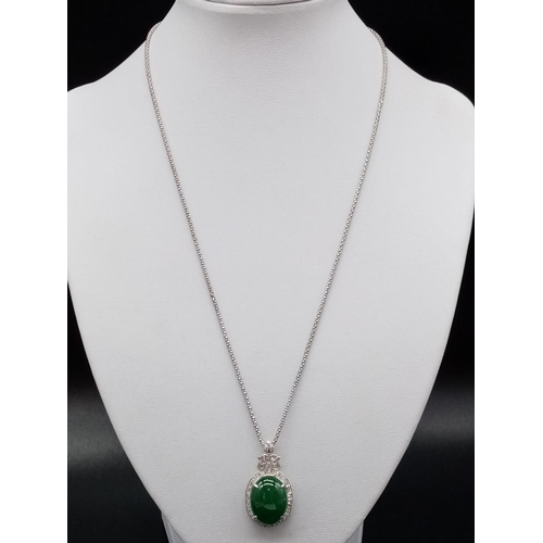 116 - 18ct White Gold and Diamond PENDANT  with Emerald Cabochon Stone on a 46cm 18ct Gold CHAIN.   12.1g