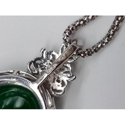 116 - 18ct White Gold and Diamond PENDANT  with Emerald Cabochon Stone on a 46cm 18ct Gold CHAIN.   12.1g