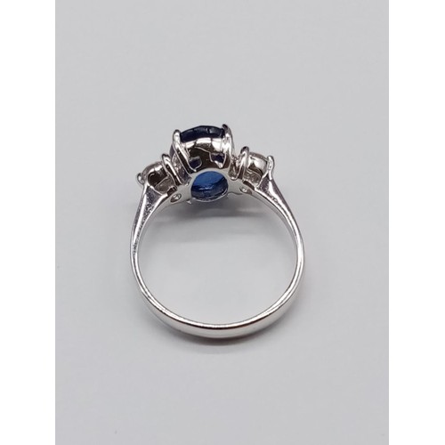 25 - 18ct White Gold RING set with one oval cut natural Sapphire and 2x round brilliant cut natural Diamo... 