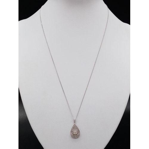 128 - 9K diamond pendant and chain. Approx 44cm. 2.55g