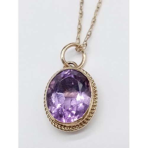 566 - Amethyst PENDANT set in 9ct Gold on a 9ct Gold CHAIN.   2.16g     50cm long.