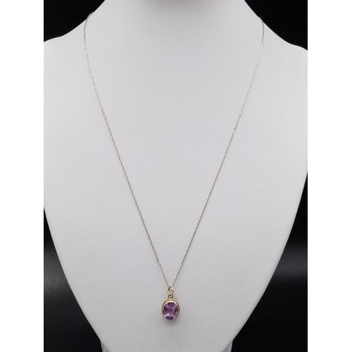 566 - Amethyst PENDANT set in 9ct Gold on a 9ct Gold CHAIN.   2.16g     50cm long.