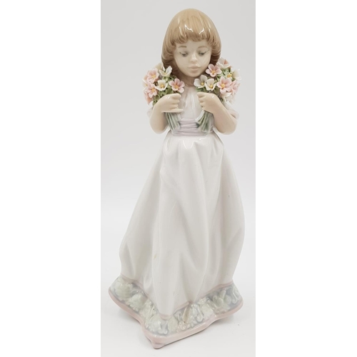 185 - Lladro Porcelain Figure - Girl with Spring Bouquets of Flowers. 1987. 21cm high.