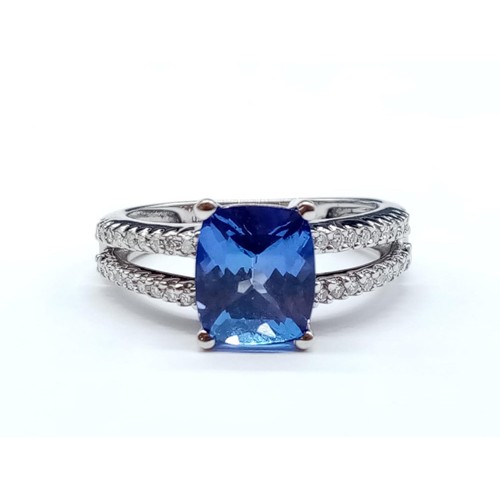 188 - 18ct White Gold Tanzanite RING with a large Tanzanite centre and encrusted Diamonds on the shoulders... 