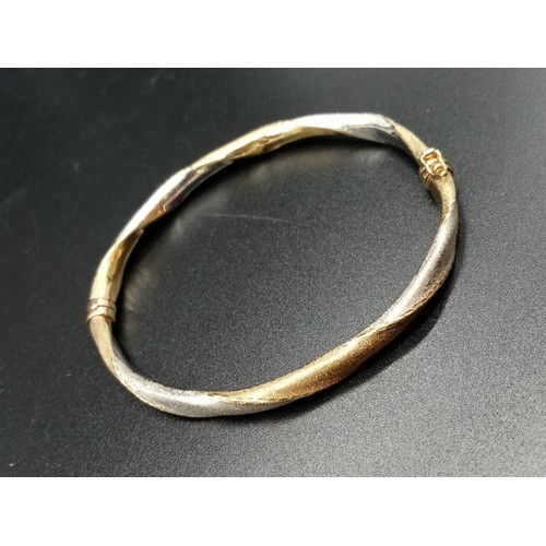 95 - 9ct Yellow and White Gold Twisted BANGLE.  6.1g  6.5cm inner diameter.  in a Jeweller's Presentation... 