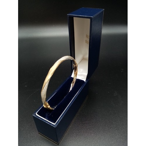 95 - 9ct Yellow and White Gold Twisted BANGLE.  6.1g  6.5cm inner diameter.  in a Jeweller's Presentation... 