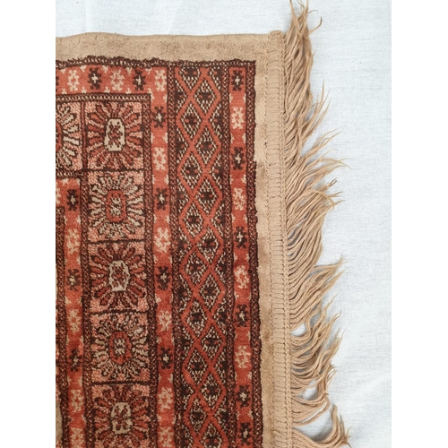 155 - Small Chinese silk rug. 106x67cm with fringed ends.