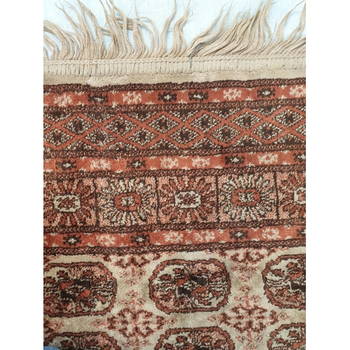 155 - Small Chinese silk rug. 106x67cm with fringed ends.