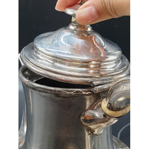 29 - An Antique Silver Coffee Pot, sitting on ornate decorated claw-feet. Classic design with slight wear... 