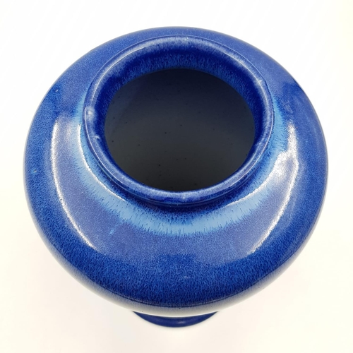 696 - A lovely blue glazed Cobridge stoneware vase. 28cm high.