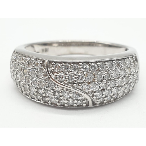 765 - 18ct diamond encrusted stylist ring. Weighs 5.6g and is a size O.