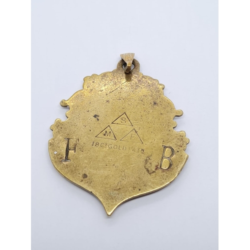 660 - Watch FOB marked as 18ct Gold. circa 1890.  
13.1g  4.5x 3.5cm