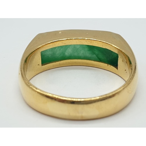 667 - 22ct gold ring with natural jade stone. 7.7g in weight and size T.