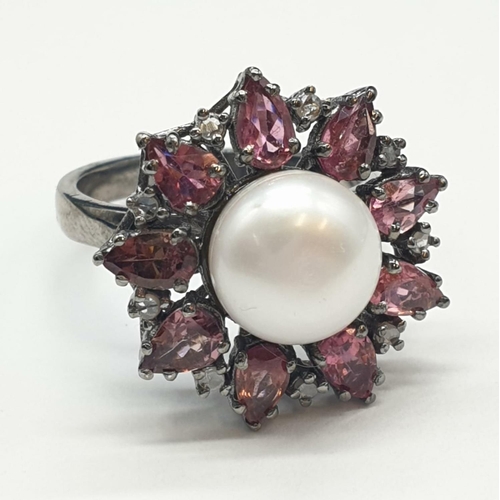 683 - 4.40 Cts Pearl & 2.35 Cts Pink Tourmalines set inside a 925 Blackened silver ring. With 0.20 Cts ros... 