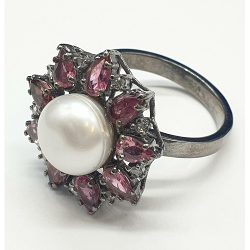 683 - 4.40 Cts Pearl & 2.35 Cts Pink Tourmalines set inside a 925 Blackened silver ring. With 0.20 Cts ros... 