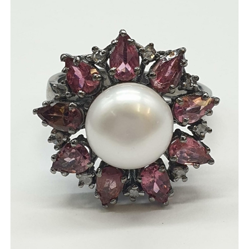 683 - 4.40 Cts Pearl & 2.35 Cts Pink Tourmalines set inside a 925 Blackened silver ring. With 0.20 Cts ros... 