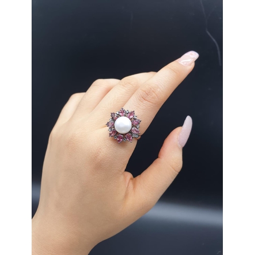 683 - 4.40 Cts Pearl & 2.35 Cts Pink Tourmalines set inside a 925 Blackened silver ring. With 0.20 Cts ros... 