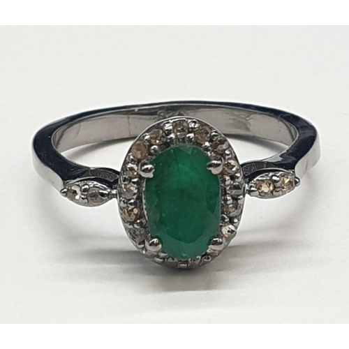 543 - 925 Silver Emerald Ring with a 1ct Emerald and 0.30ct Diamonds, weight 2.96g and size N