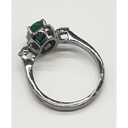 543 - 925 Silver Emerald Ring with a 1ct Emerald and 0.30ct Diamonds, weight 2.96g and size N