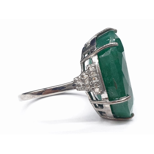 289 - 22 Ct Emerald set within a 925 silver ring, with 0.20 Cts Rose cut diamonds, WEIGHT 7.5g and size M